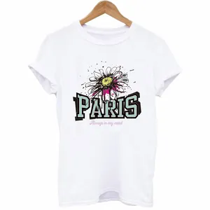White casual T-shirt featuring a hand-drawn daisy and Paris graphic print on a hanger