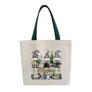 Close-up of three festive gnomes with Merry Christmas text on a white canvas tote bag