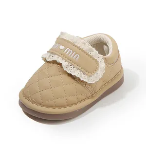 Quilted leather baby girl walking shoes with lace trim and soft sole