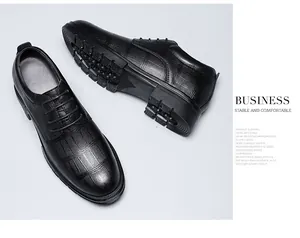 Close-up of black embossed leather shoes showing the 8cm height-increasing sole design
