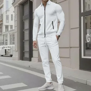 Close-up of white textured two-piece men's track suit with black zipper details