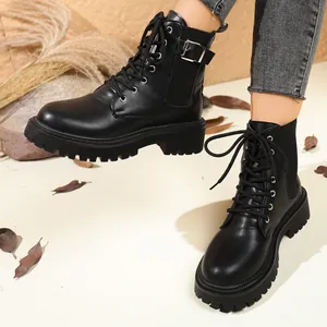 Stylish black chunky platform ankle boots featuring side buckle and front lace-up design