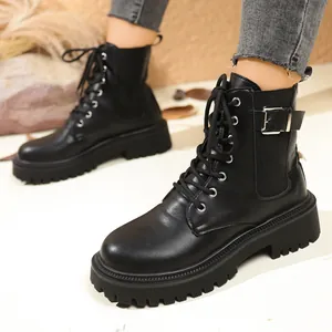 British style black platform combat boots with buckle strap and front lace-up design for women
