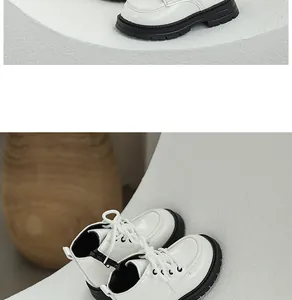Detail view of white patent leather children's Martin boots with soft non-slip soles