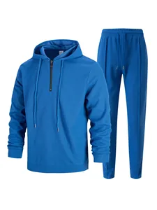 Tuta da uomo blu in tessuto waffle con felpa con cappuccio a mezza zip e pantaloni coordinati