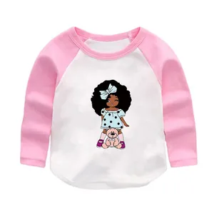 Detailed cartoon girl with teddy bear heat transfer graphic on toddler pink raglan shirt