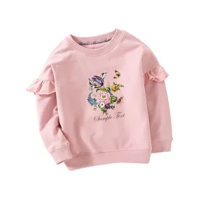 Pink girls crewneck sweatshirt with cute floral pattern and ruffled shoulder details