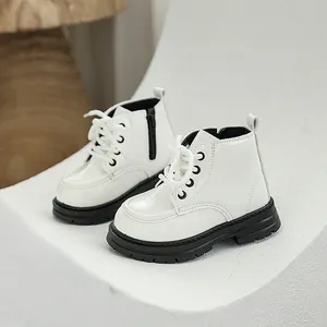 Stylish white children's Martin boots featuring soft anti-slip black soles and lace-up