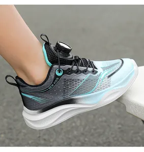 Side view of boys' breathable blue running shoes featuring a rotary lacing system