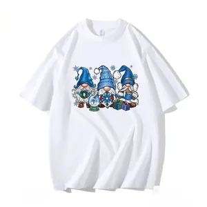 White T-shirt featuring three festive blue gnomes with Christmas winter themed graphic