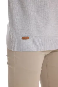 Detail of men's grey knit sweater featuring a small leather AIOPESON brand tag at the hem.