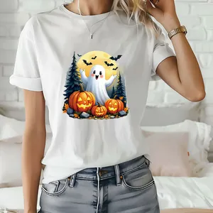 Detailed macro shot of a cute ghost and pumpkin Halloween heat transfer patch on T-shirt.