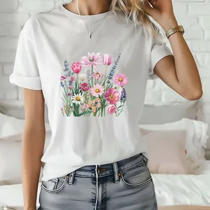 Detailed view of a white T-shirt featuring a colorful floral bouquet print design