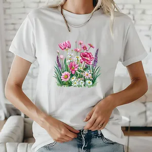 Close-up of white T-shirt featuring a colorful pink tulip and daisy floral graphic print.