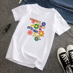 White t-shirt featuring vibrant daisy and smiley face heat transfer print for DIY clothing