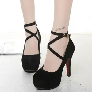 Elegant black platform high heels with cross ankle straps and sleek stiletto heel