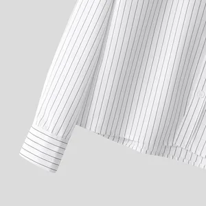 Close-up detail shot of men's white striped shirt sleeve cuff and fabric texture
