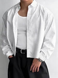 Men's stylish loose white vertical striped long sleeve shirt paired with a white ribbed tank top