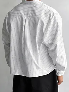 Men's oversized long sleeve white shirt with vertical stripes seen from the back