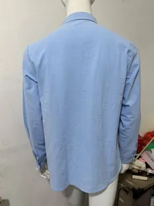 Back view detail of a light blue linen long sleeve casual shirt for men with relaxed fit