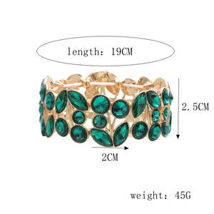 Detail view showing dimensions and 45g weight of gold green crystal leaf wide bracelet