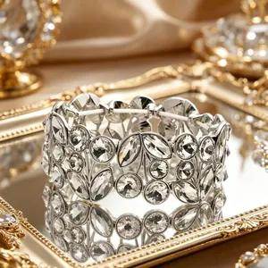 Close-up detail of a vintage wide silver bracelet featuring clear leaf-shaped crystals