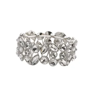 Detailed close-up of a vintage wide silver stretch bracelet with leaf crystal patterns