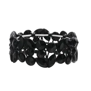 Detailed view of vintage wide black crystal bracelet with leaf and round patterns
