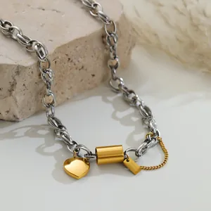 Detailed view of stainless steel chunky chain necklace with heart and bar pendants.