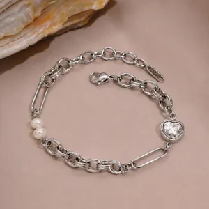 Detailed view of silver stainless steel heart cubic zirconia and pearl bracelet
