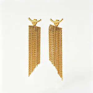 Close-up of gold stainless steel arc earrings featuring layered snake chain tassels.