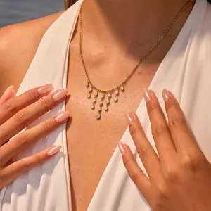 Elegant gold stainless steel necklace featuring sparkling zirconia fringe tassel pendants
