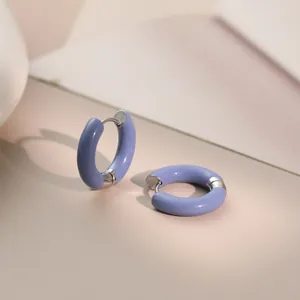 Detailed close-up of lavender enamel hoop earrings in stainless steel with sleek finish