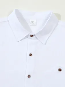 Close-up of white linen blend shirt collar with wooden buttons and fabric texture detail