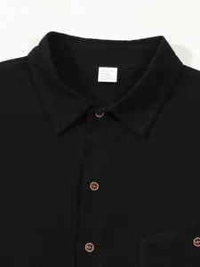 Close-up of men's linen shirt collar and size label showing fabric composition