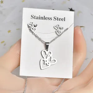 Polished stainless steel jewelry set with overlapping heart necklace and stud earrings