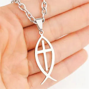 Close-up detail of polished stainless steel Ichthys fish pendant with an inner cross