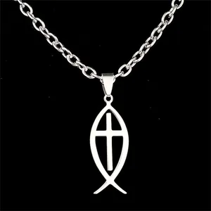Close-up of polished stainless steel Ichthys fish pendant with inner cross detail
