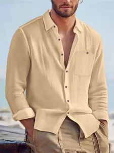 Close-up of men's casual linen long-sleeve shirt in beige with pocket and rolled sleeves