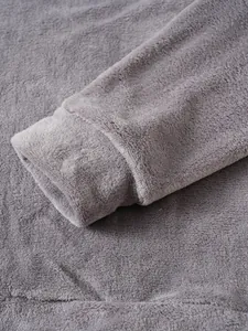 Close-up of grey coral fleece hoodie cuff showing soft fuzzy texture and stitching