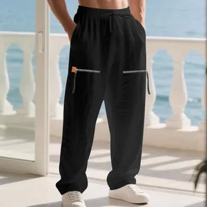 Pantalon en lin noir ample avec fermetures éclair décoratives et cordon de serrage.