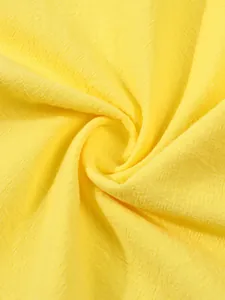 Macro view of bright yellow breathable linen fabric texture for men's casual shirt