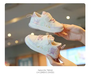 Detail of breathable toddler walking shoes with cute bear patches and soft soles.