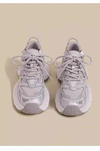 Detailed front view of breathable grey mesh chunky sneakers for kids and teens.