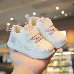 White and pink toddler walking shoes with soft soles and velcro strap for babies aged 1-3
