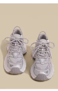 Detailed top view of grey breathable mesh sneakers for kids with stylish layered design