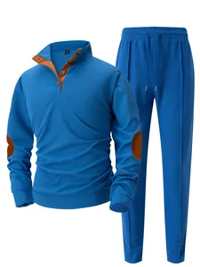 Men's blue waffle knit tracksuit set with orange elbow patches and stand collar details.