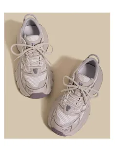 Top-down view of breathable beige and purple children's chunky sneakers.