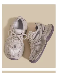 Close-up view of breathable children mesh dad sneakers with chunky sole in beige and purple