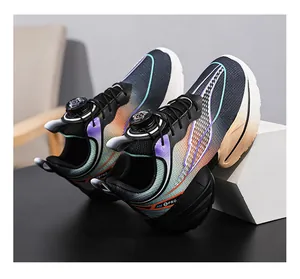 Close-up detail of boys' sports running shoe with unique gradient design and rotary buckle